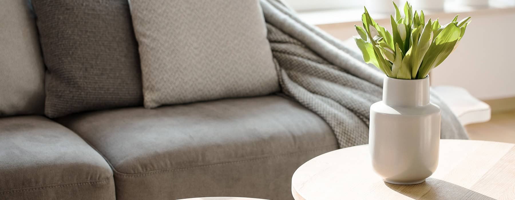 modern decor on a coffee table in a bright living room